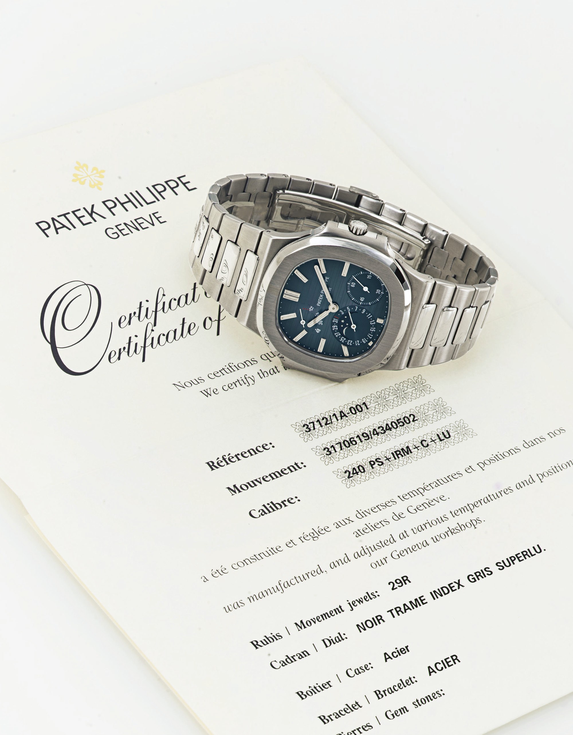 PATEK PHILIPPE.  A STAINLESS STEEL AUTOMATIC WRISTWATCH WITH DATE, MOON PHASES AND POWER RESERVE