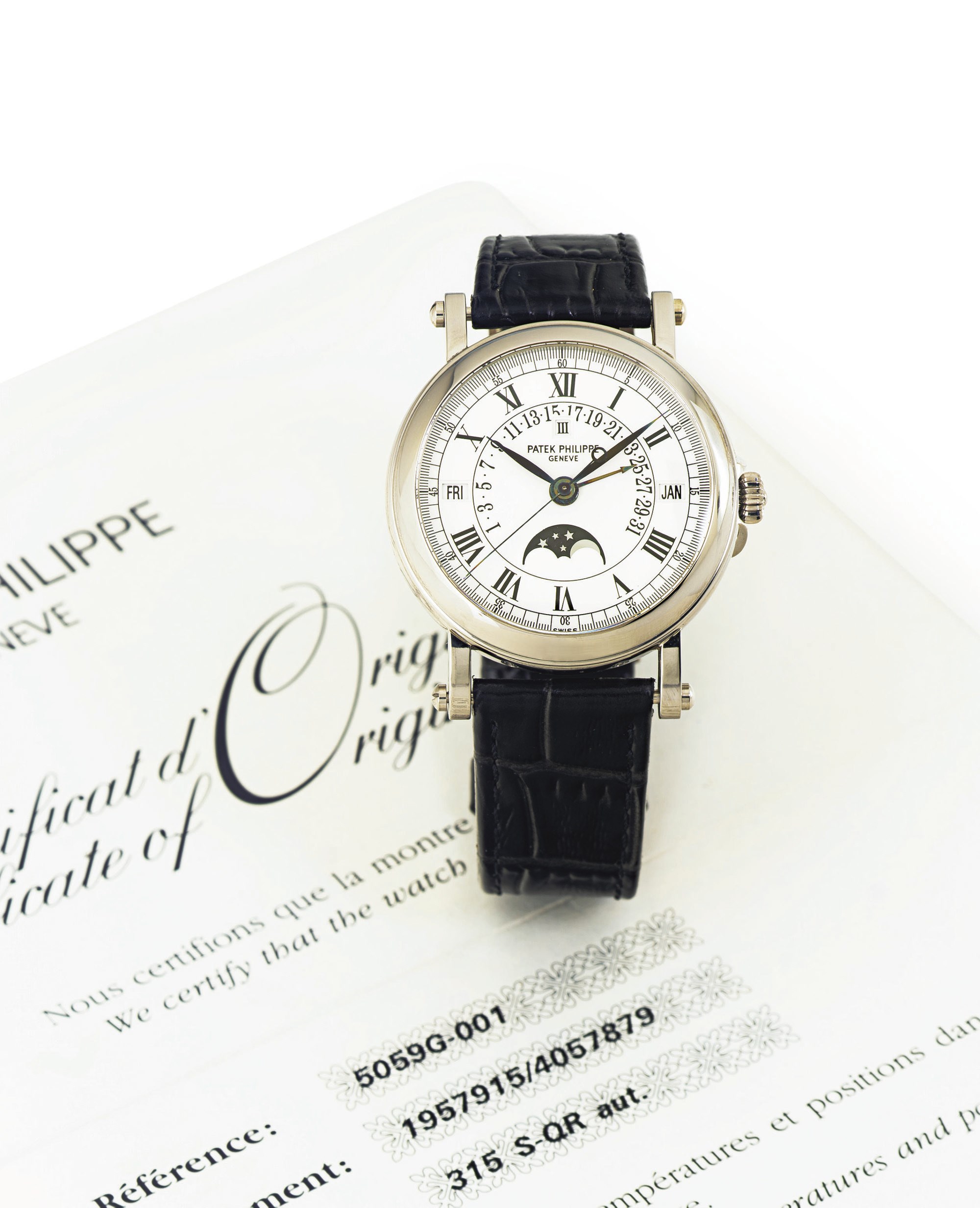 PATEK PHILIPPE.  A FINE AND RARE 18K WHITE GOLD AUTOMATIC PERPETUAL CALENDAR WRISTWATCH WITH RETROGRADE DATE AND MOON PHASES