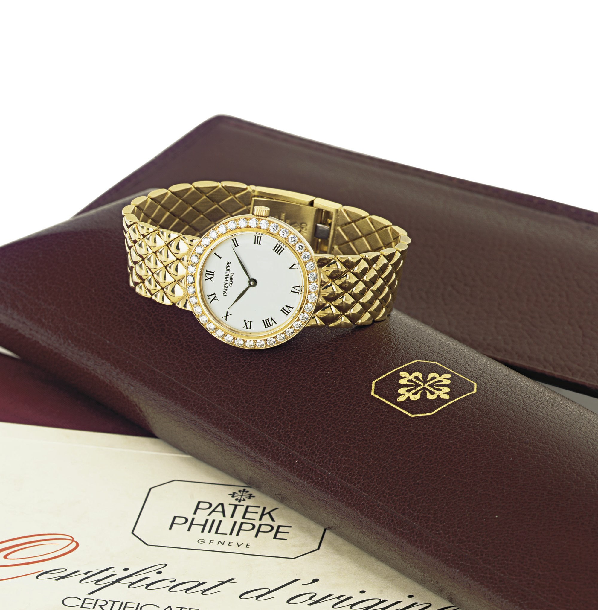 PATEK PHILIPPE. A LADY'S 18K GOLD AND DIAMOND WRISTWATCH WITH BRACELET