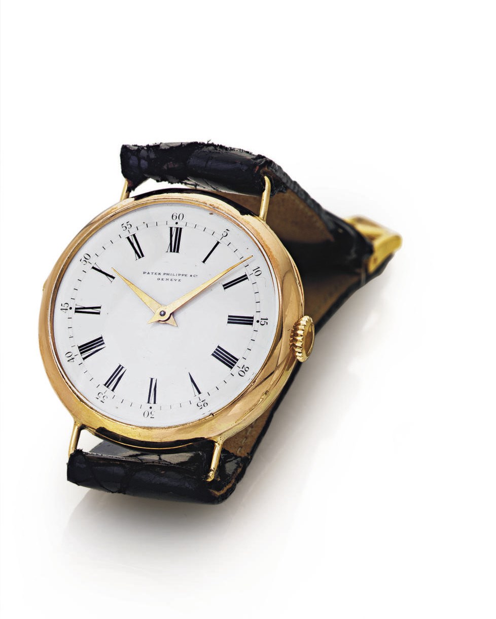 PATEK PHILIPPE. AN 18K PINK GOLD WRISTWATCH WITH ENAMEL DIAL CONVERTED FROM A CYLINDER PENDANT WATCH