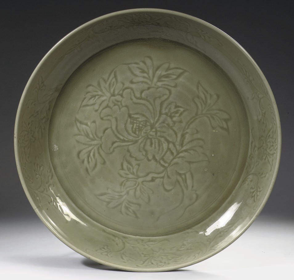 A massive Chinese Longquan celadon charger