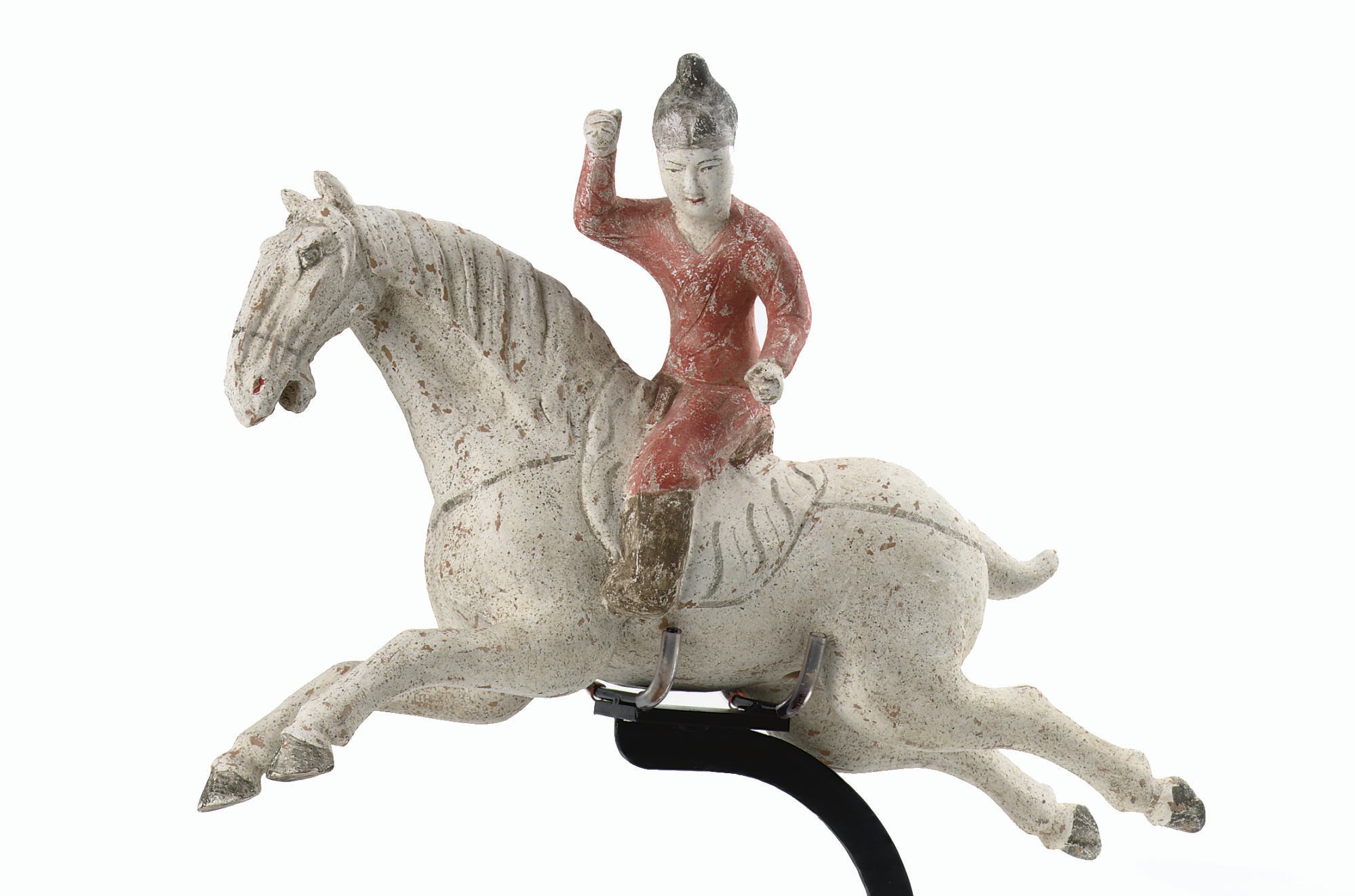A Chinese painted pottery figure of a female polo player