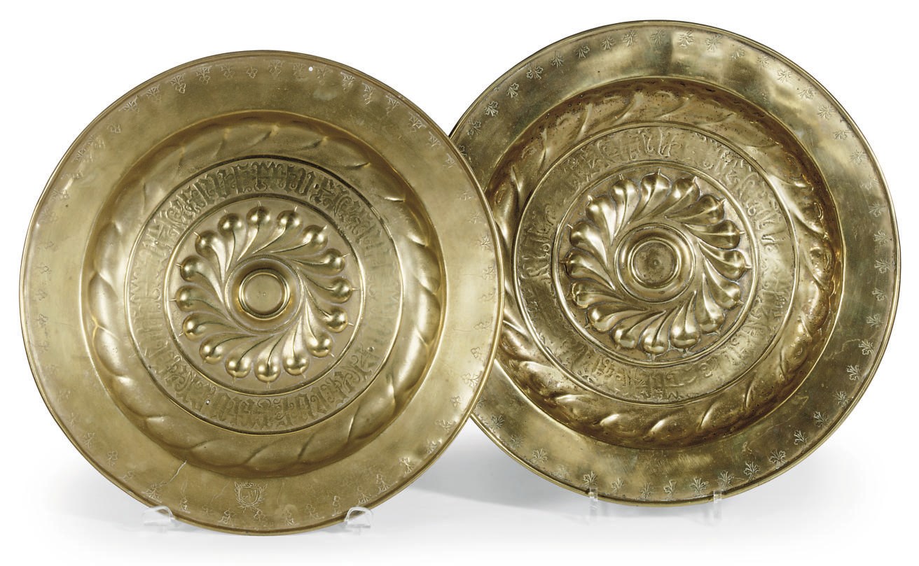 TWO SIMILAR BRASS ALMS DISHES