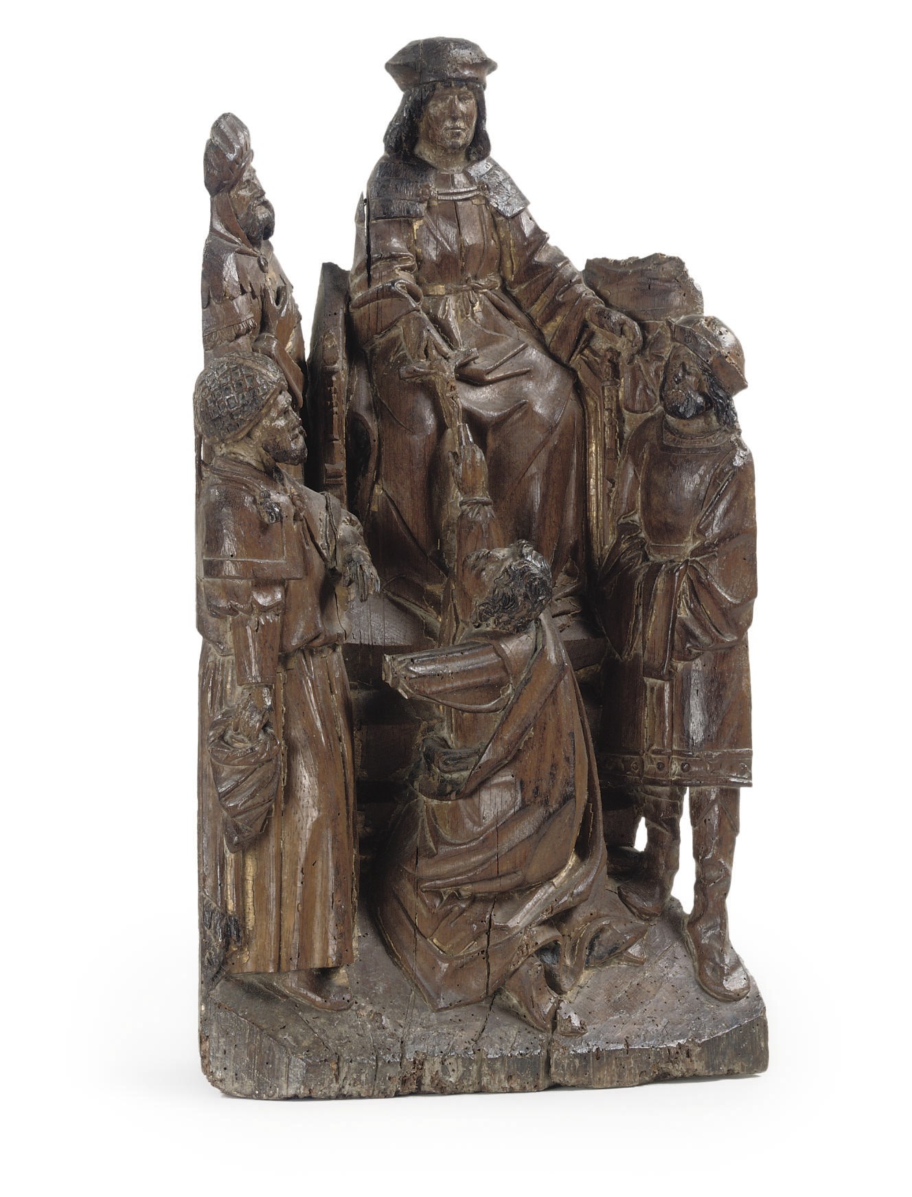 A CARVED OAK GROUP OF AN ENTHRONED KING AND ATTENDANT FIGURES
