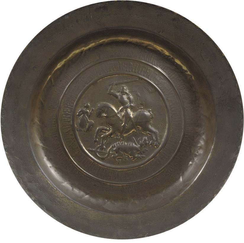A GERMAN BRASS ALMS DISH