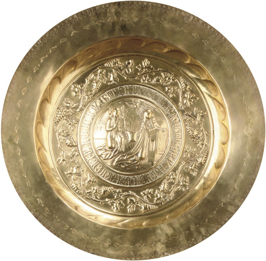 A GERMAN BRASS ALMS DISH