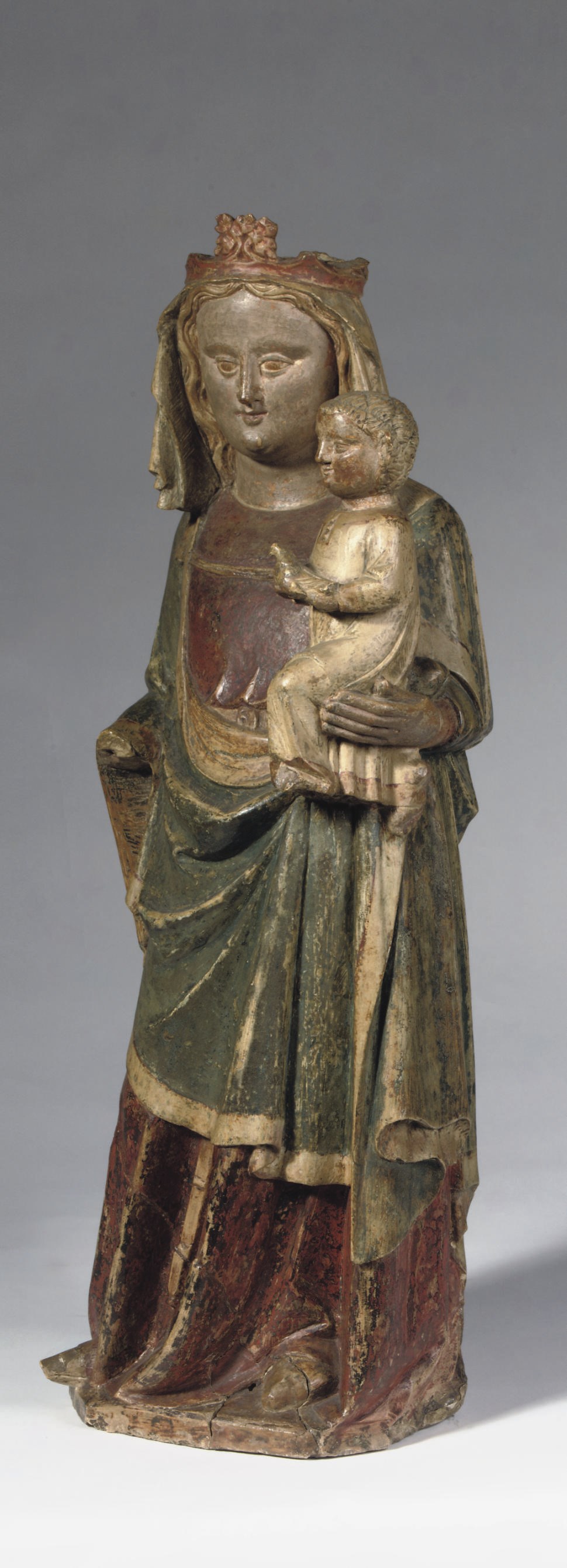 A POLYCHROME CARVED LIMESTONE GROUP OF THE VIRGIN AND CHILD