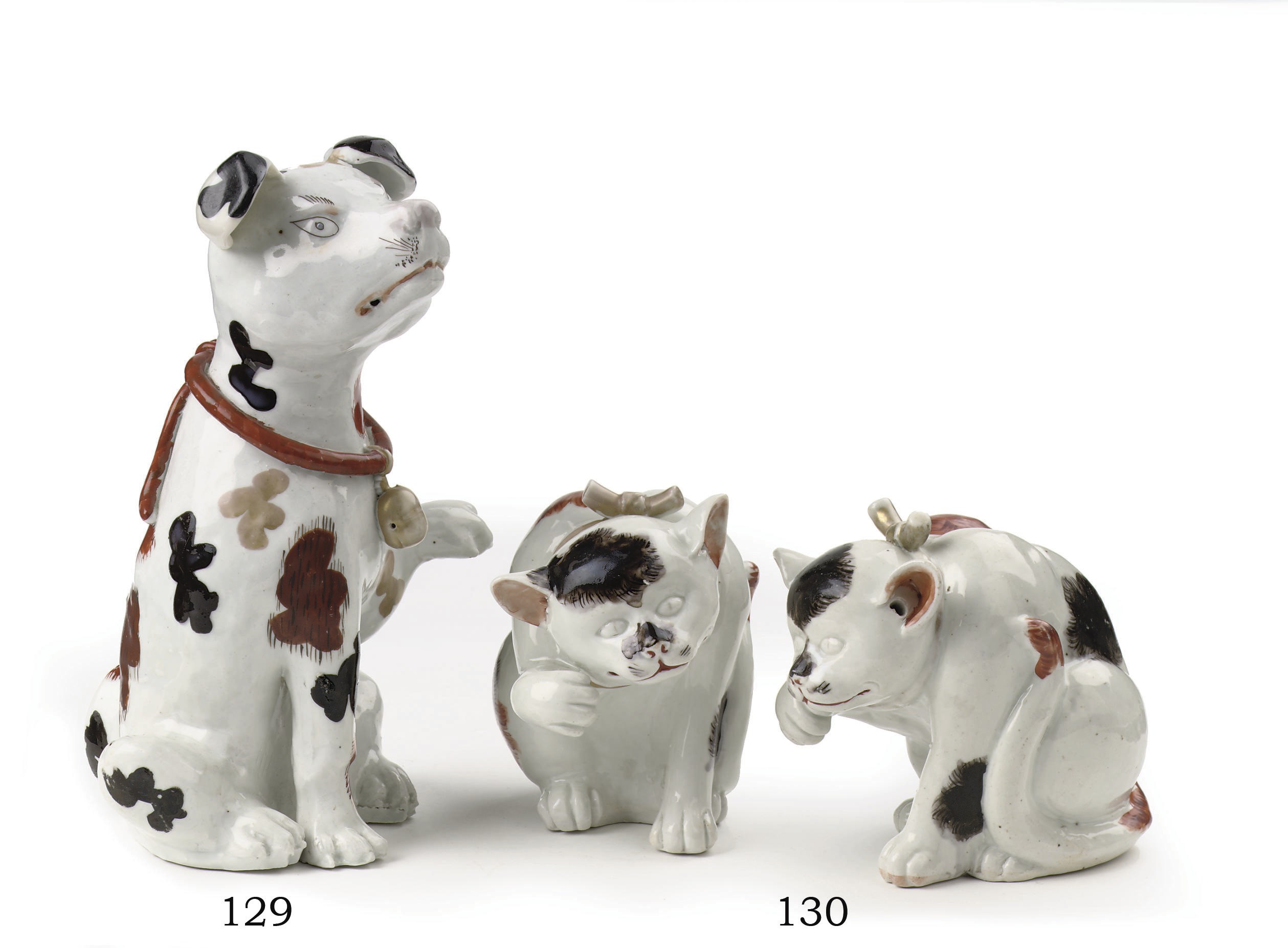 A pair of Japanese Arita models of cats