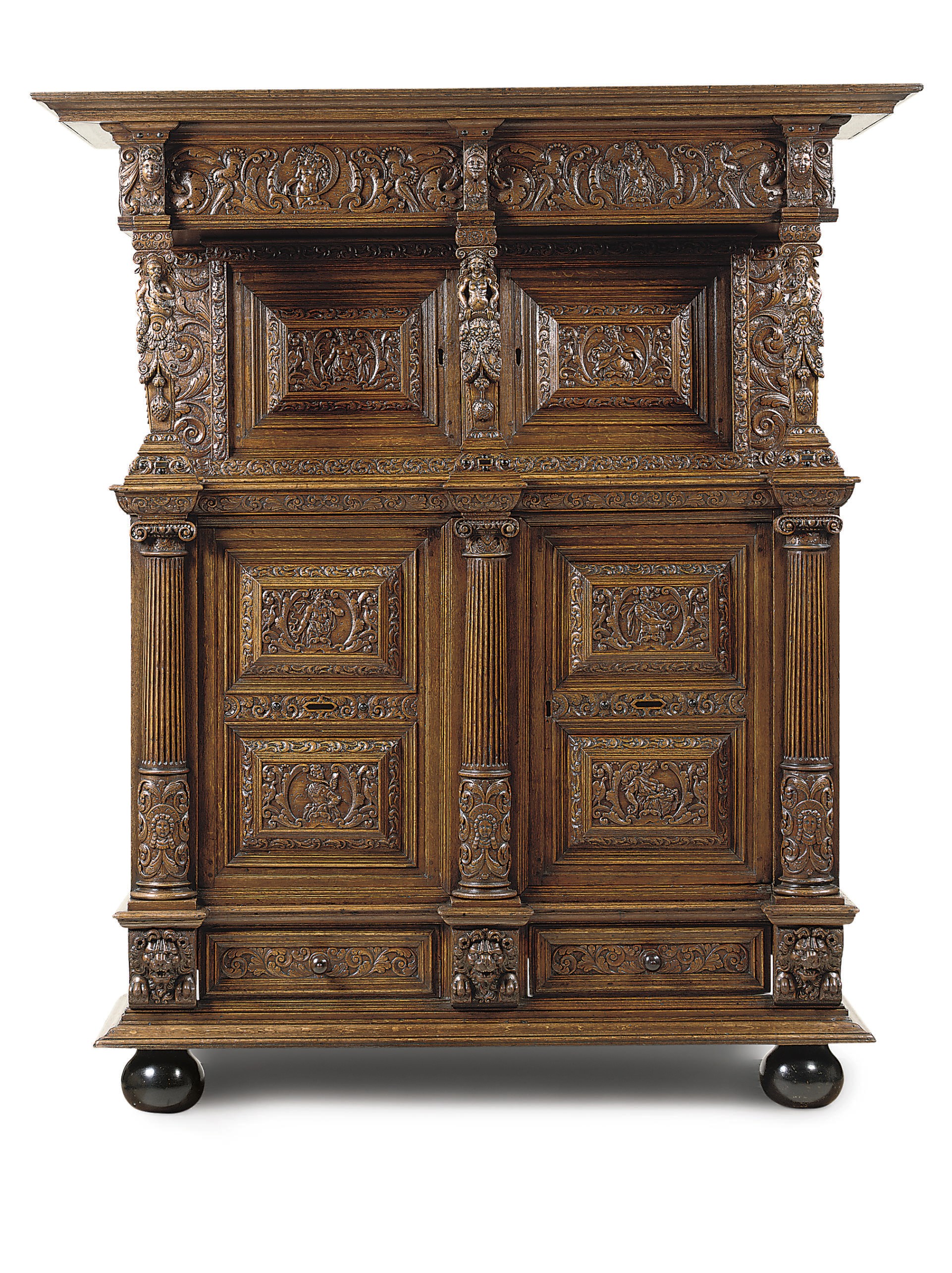 A DUTCH CARVED OAK CUPBOARD
