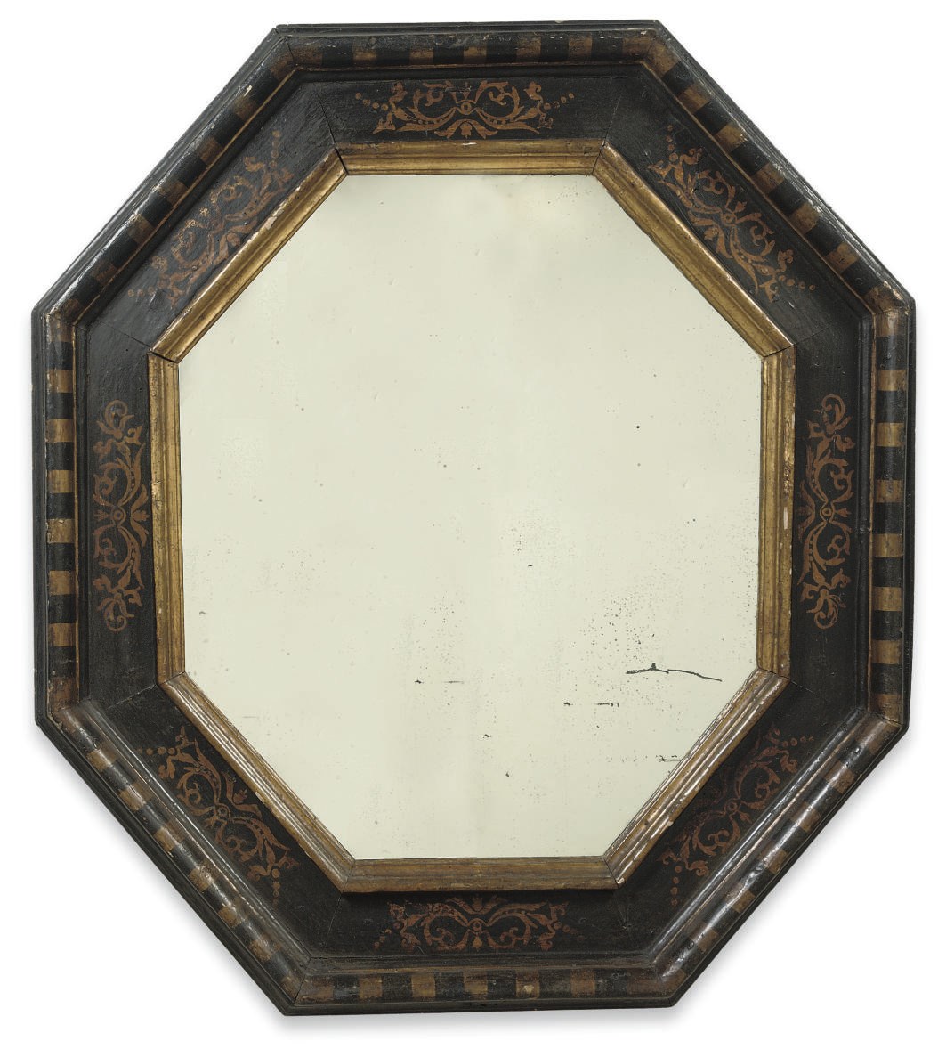 A MATCHED PAIR OF ITALIAN PARCEL-GILT EBONIZED MIRRORS