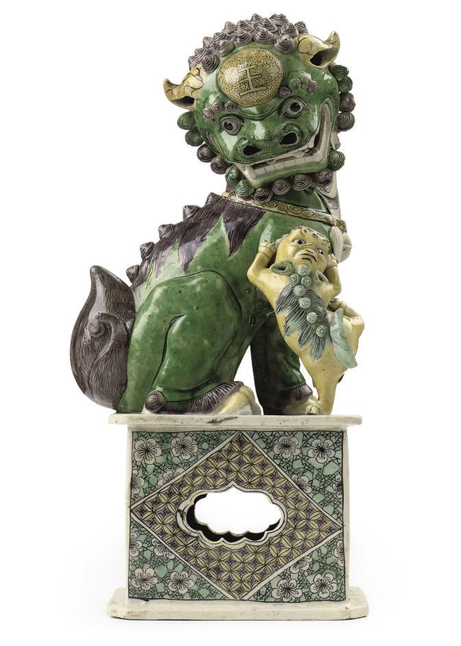 A Chinese famille verte biscuit buddhistic lion