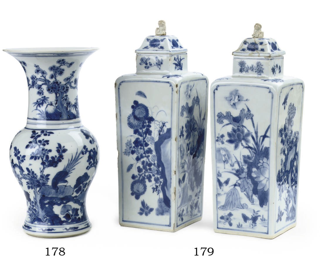 A pair of Chinese blue and white square bottle vases and covers