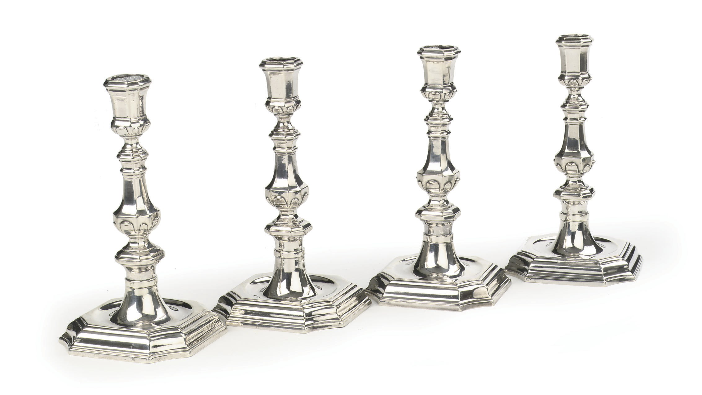 Four Dutch silver candlesticks