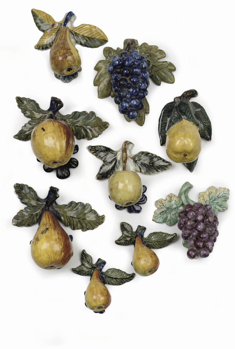 A set of nine Dutch Delft polychrome models of fruit