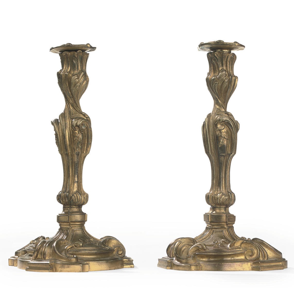 A PAIR OF FRENCH ORMOLU CANDLESTICKS