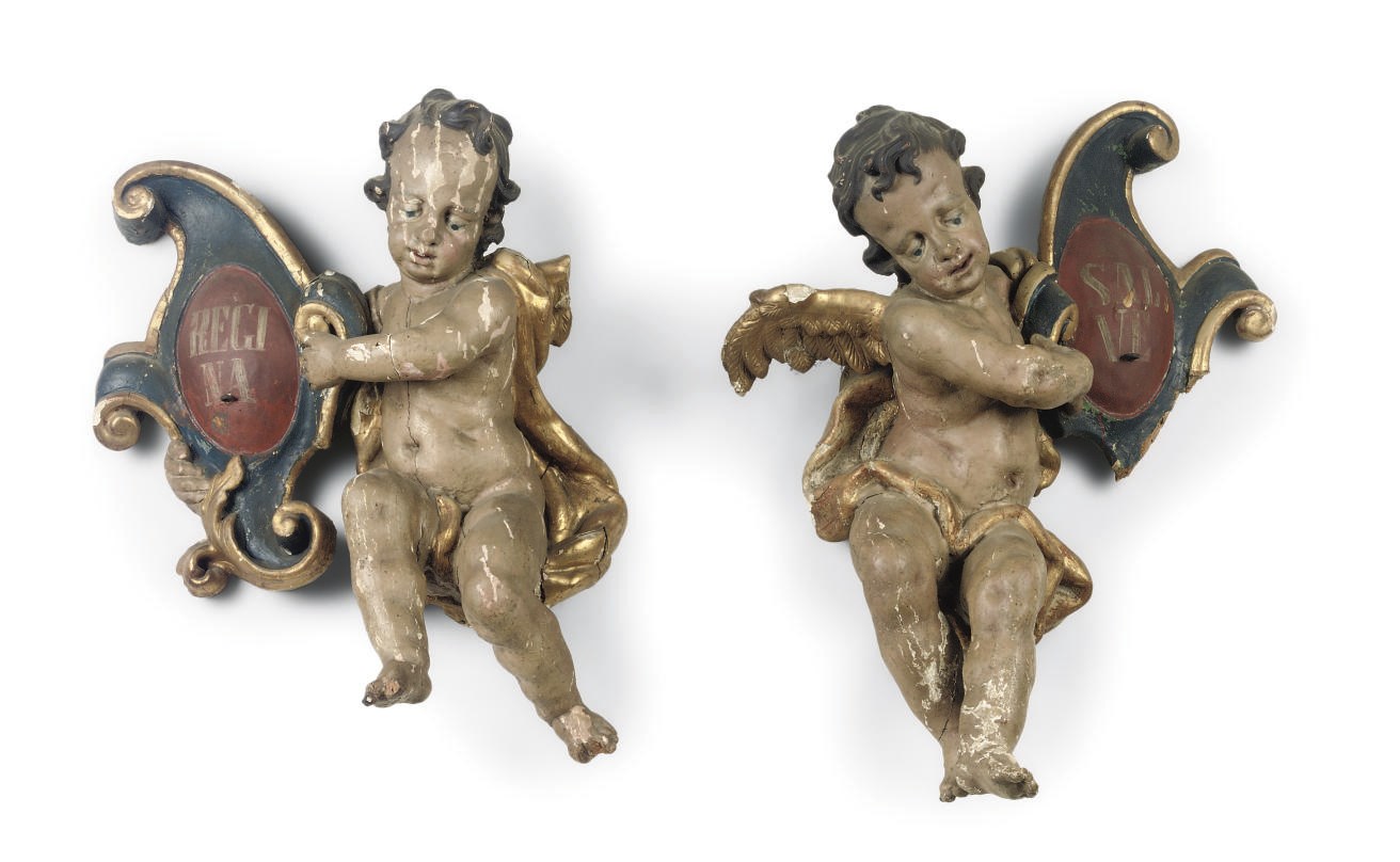 A PAIR OF PARCEL-GILT AND POLYCHROME CARVED WOOD FIGURES OF CHERUBS