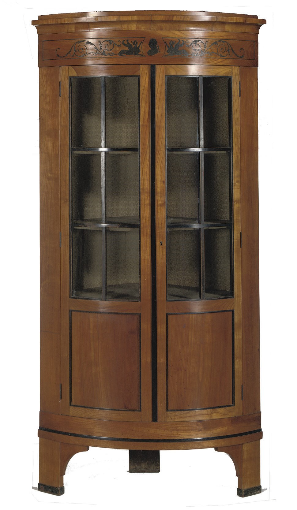 A GERMAN CHERRYWOOD, EBONIZED, PASTE-INLAID CORNER CUPBOARD