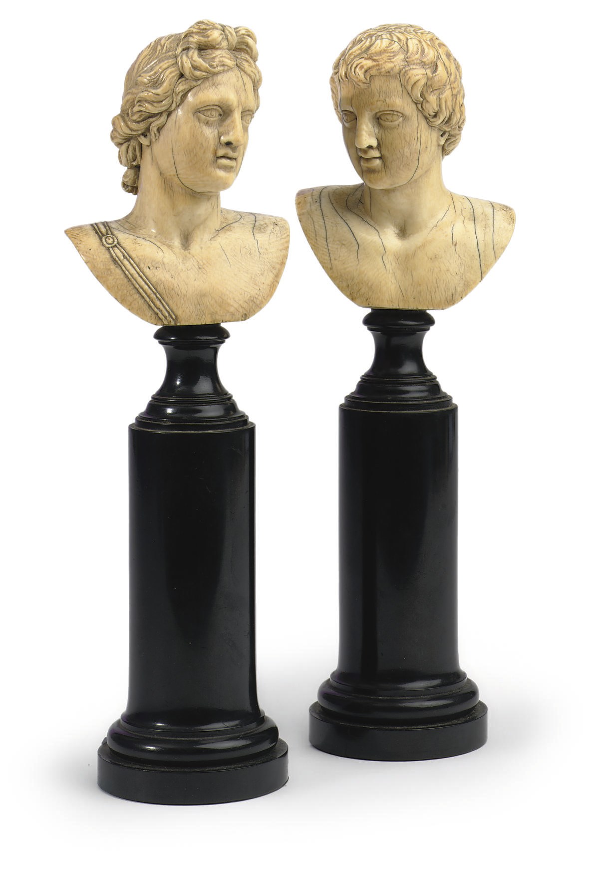 A PAIR OF CARVED IVORY BUSTS OF THE APOLLO BELVEDERE AND THE FARNESE ANTINOUS