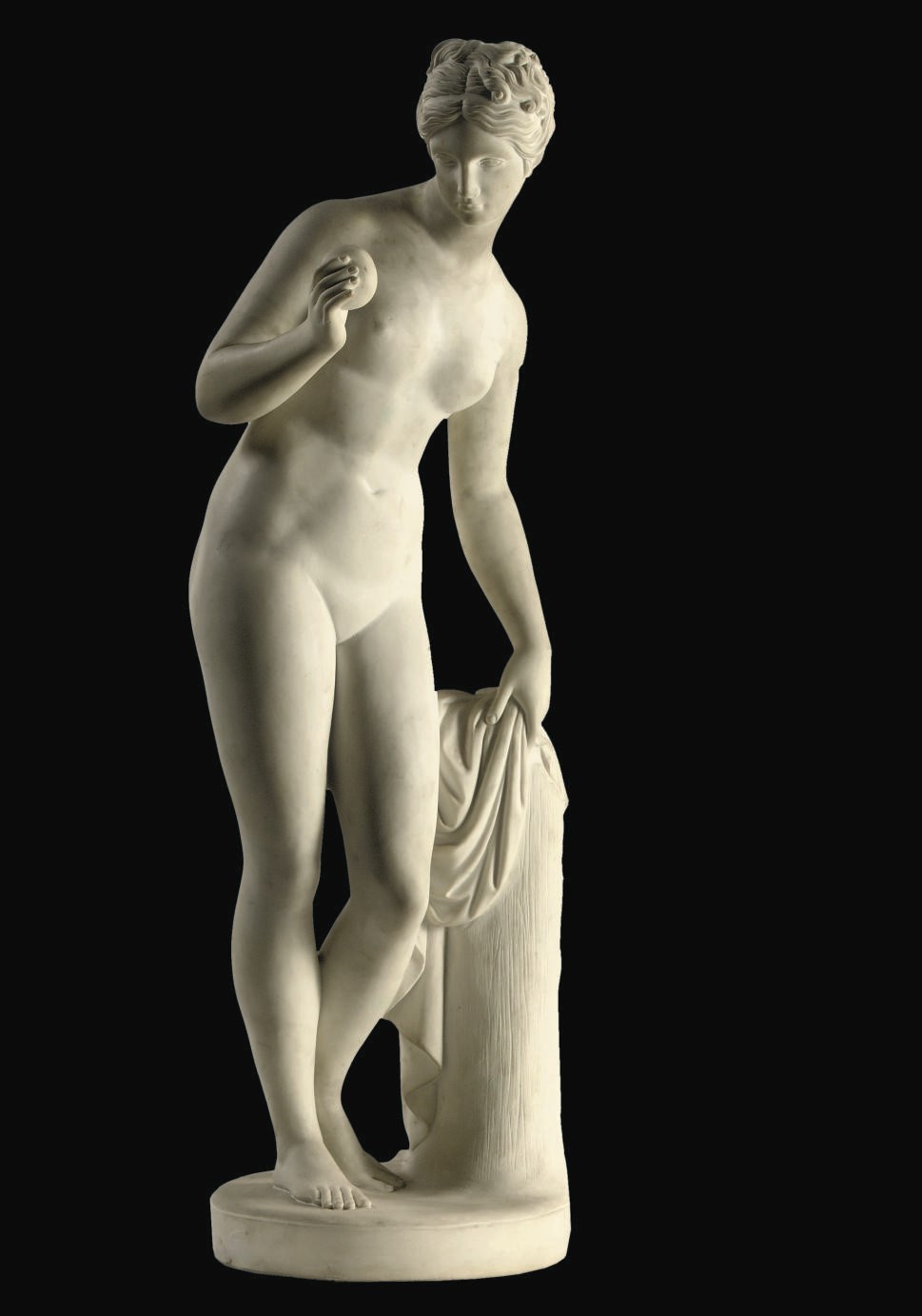 A WHITE MARBLE FIGURE OF VENUS WITH THE APPLE