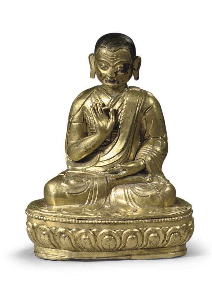 A large tibetan gilt-copper repousse figure of a Lama