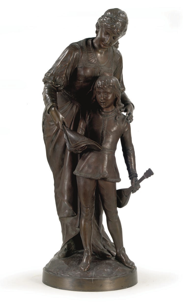 A BRONZE GROUP OF A LADY AND A BOY MAKING MUSIC