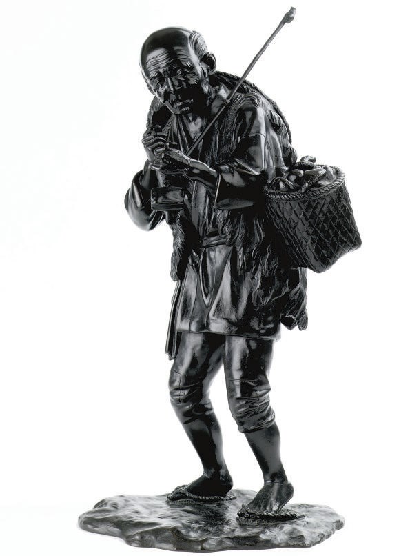 A Japanese bronze figure of a mushroom collector
