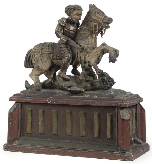 A GERMAN POLYCHROME DECORATED CHEST WITH HINGED LID SURMOUNTED BY AN EQUESTRIAN GROUP OF ST GEORGE AND THE DRAGON