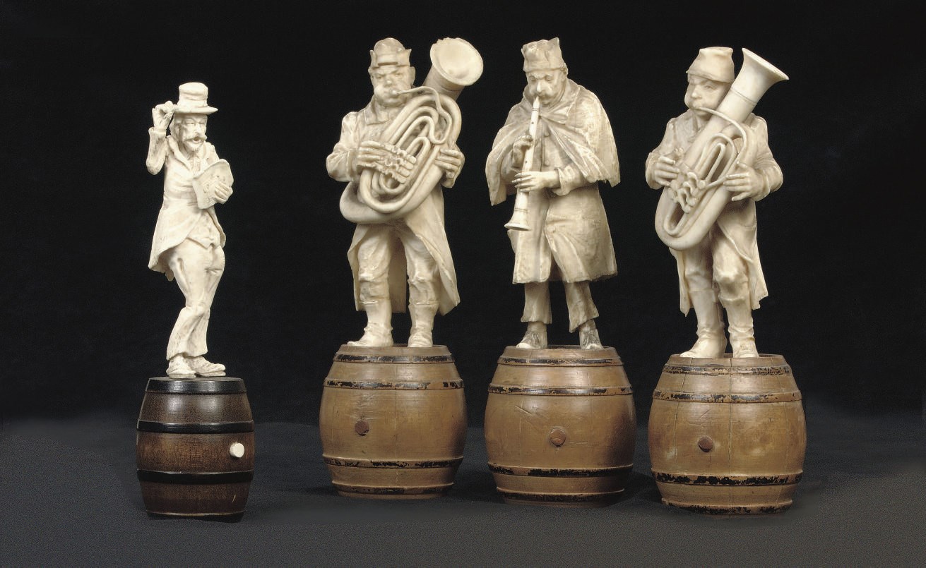 A GROUP OF THREE AUSTRIAN CARVED WOOD AND IVORY FIGURES OF MUSICIANS