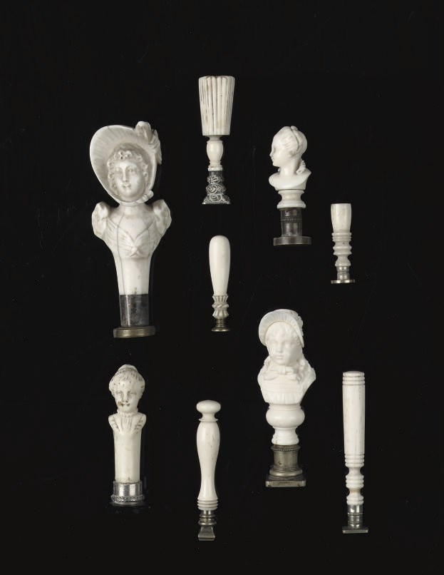 NINE VARIOUS CARVED IVORY AND BONE SEALS