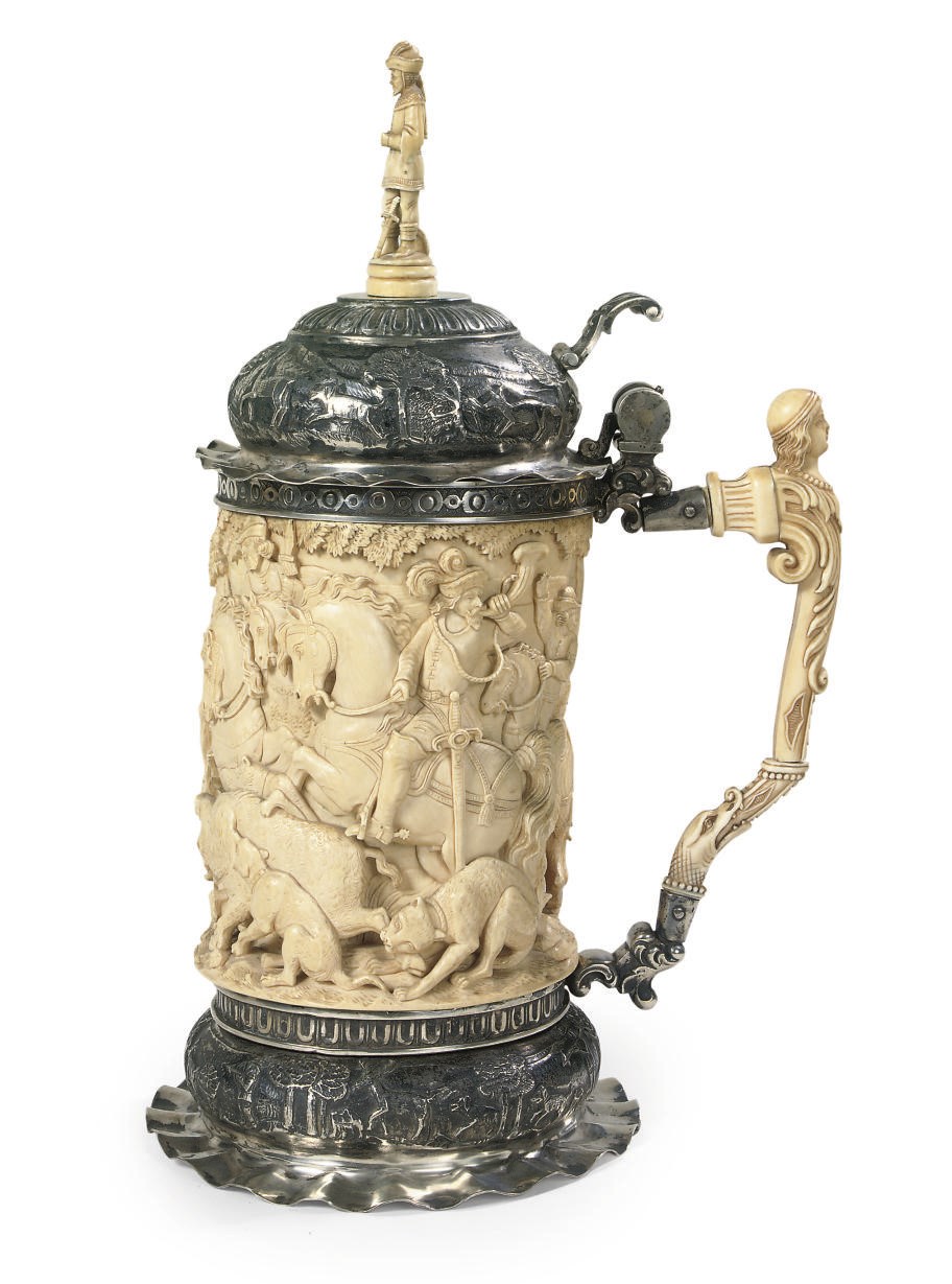 A SILVER-MOUNTED RELIEF CARVED IVORY TANKARD