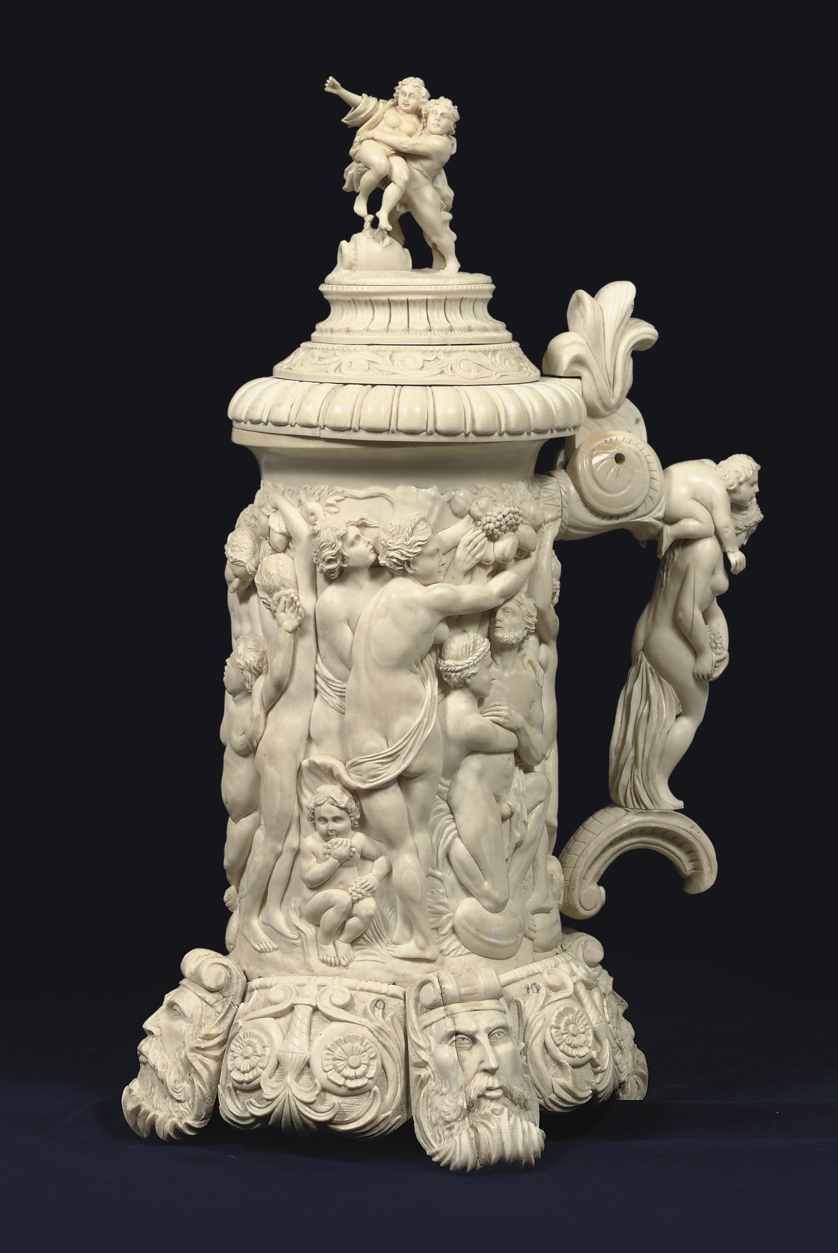 A LARGE CARVED IVORY TANKARD