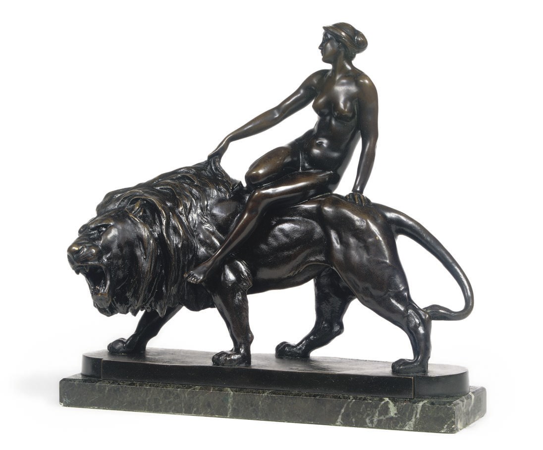 A BRONZE GROUP OF A FEMALE NUDE ON A LION 'LÖWENBRAUT'