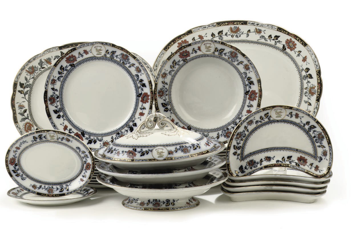 A Staffordshire Imari armorial part dinner service