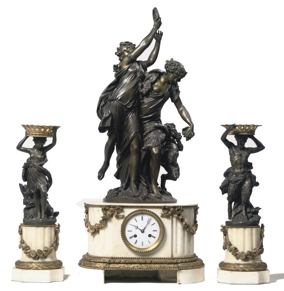 A NAPOLEON III ORMOLU-MOUNTED, WHITE MARBLE AND PATINATED BRONZE FIGURAL STRIKING MANTEL CLOCK AND GARNITURE