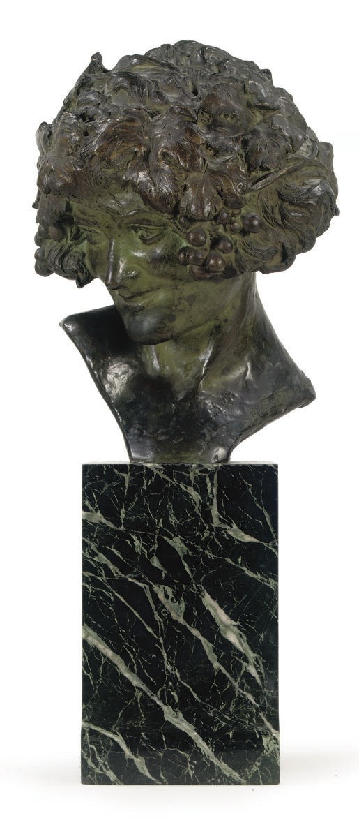 A BRONZE BUST OF A BACCHANTE