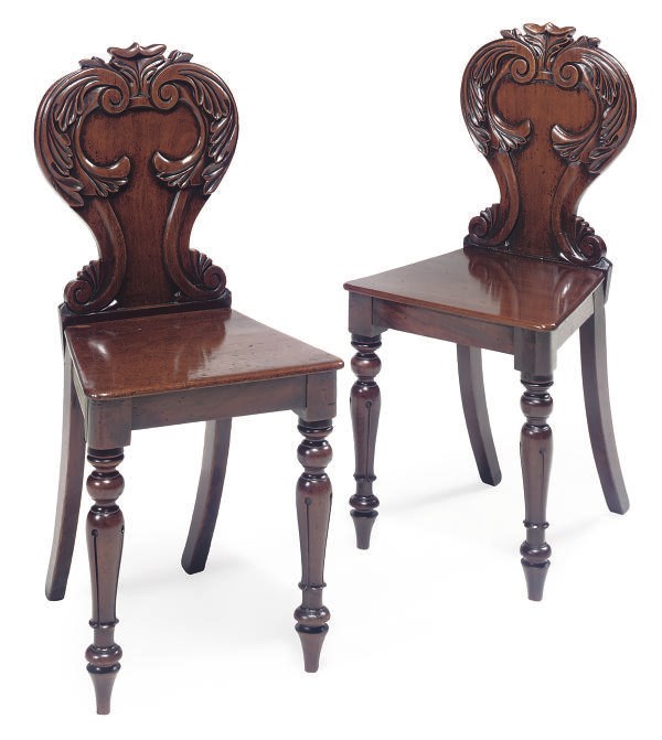 A PAIR OF WILLIAM IV MAHOGANY HALL CHAIRS