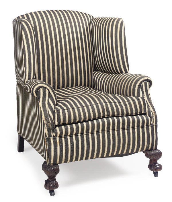 A WALNUT WINGBACK ARMCHAIR