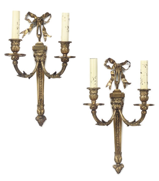A PAIR OF GILT BRASS TWIN-BRANCH WALL APPLIQUES