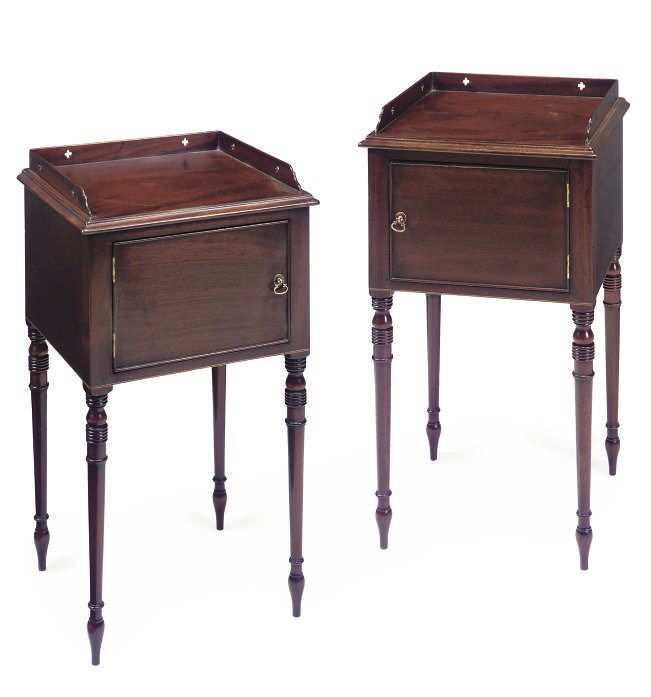 A PAIR OF MAHOGANY BEDSIDE CUPBOARDS