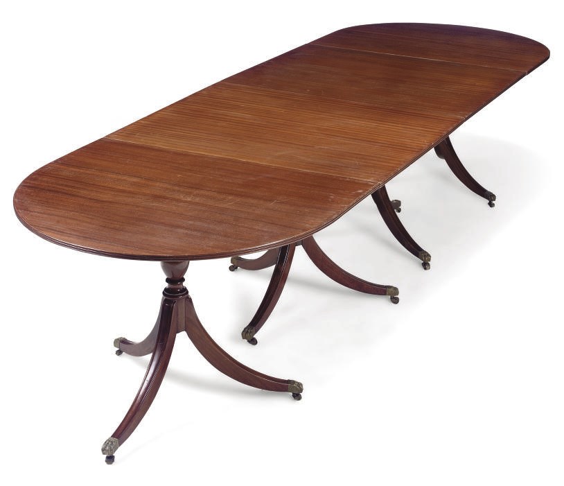A MAHOGANY FOUR-PEDESTAL DINING-TABLE