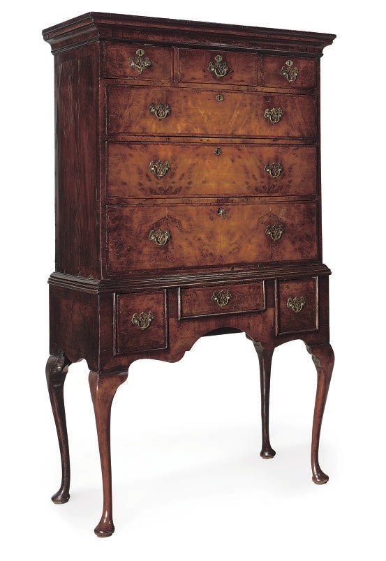 A GEORGE II WALNUT AND FEATHER CROSSBANDED CHEST