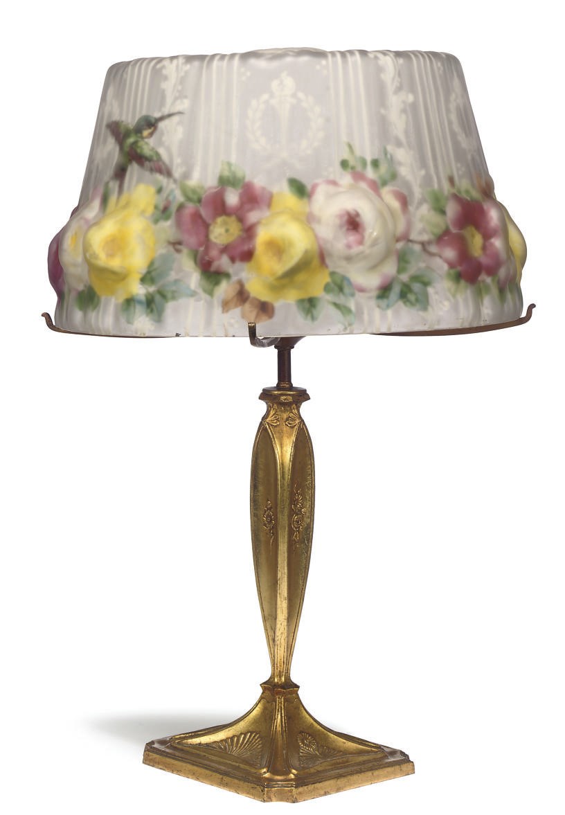 AN AMERICAN GILT COPPER AND PAINTED BLOWN GLASS TABLE LAMP