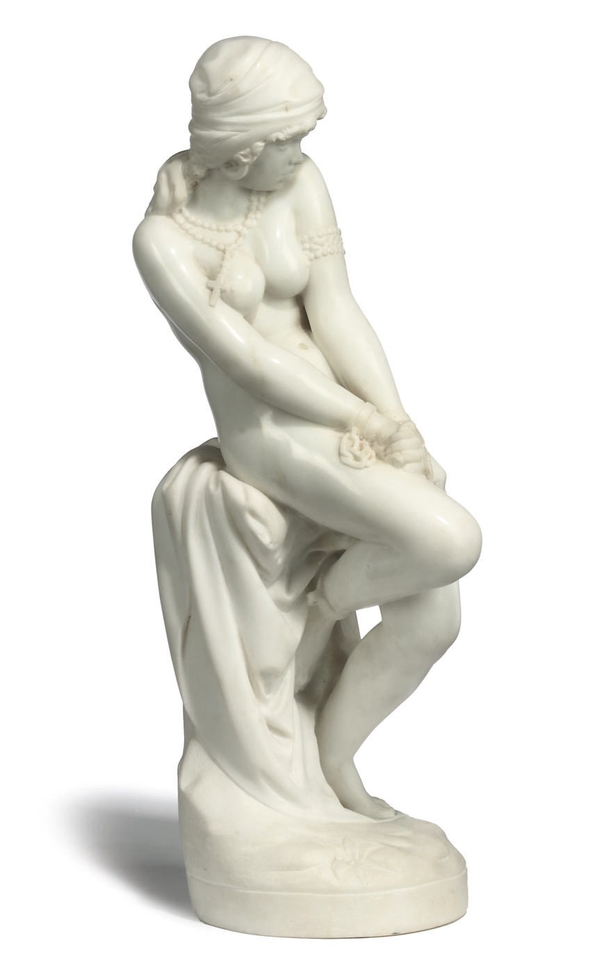 AN ITALIAN WHITE MARBLE FIGURE OF A NUBIAN SLAVE