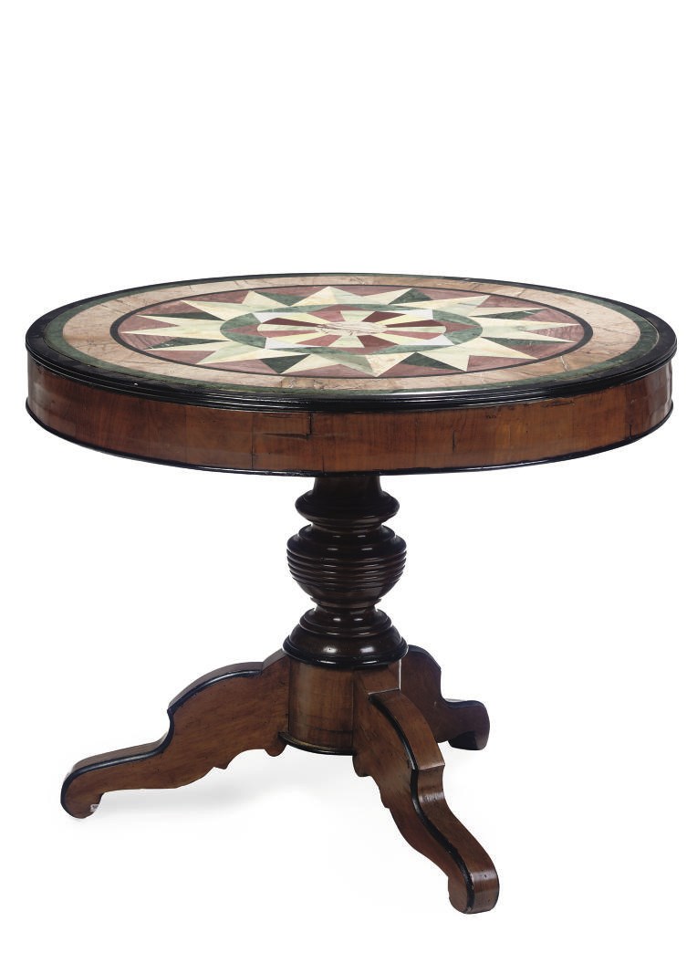 A WALNUT AND EBONISED CIRCULAR TABLE