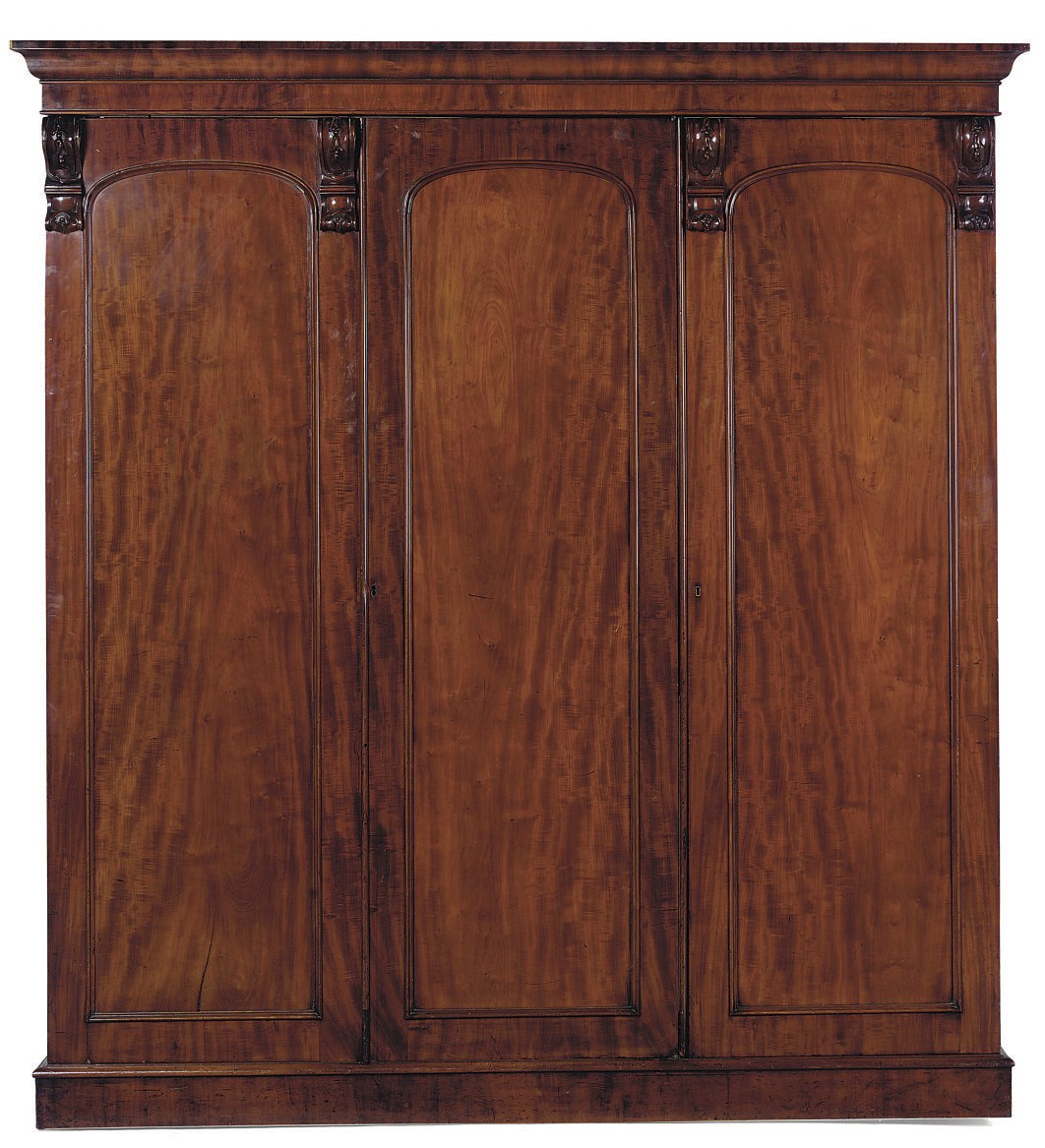 A MID VICTORIAN MAHOGANY TRIPLE WARDROBE