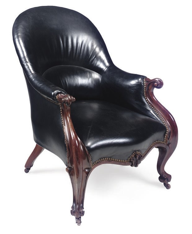 A MID VICTORIAN MAHOGANY LEATHER UPHOLSTERED ARMCHAIR