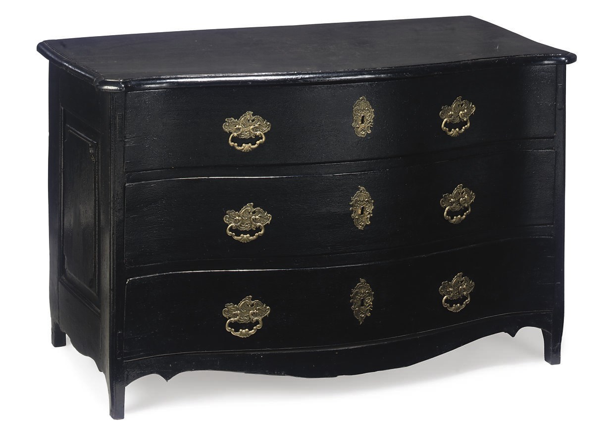 A NORTH EUROPEAN BLACK-PAINTED SERPENTINE COMMODE
