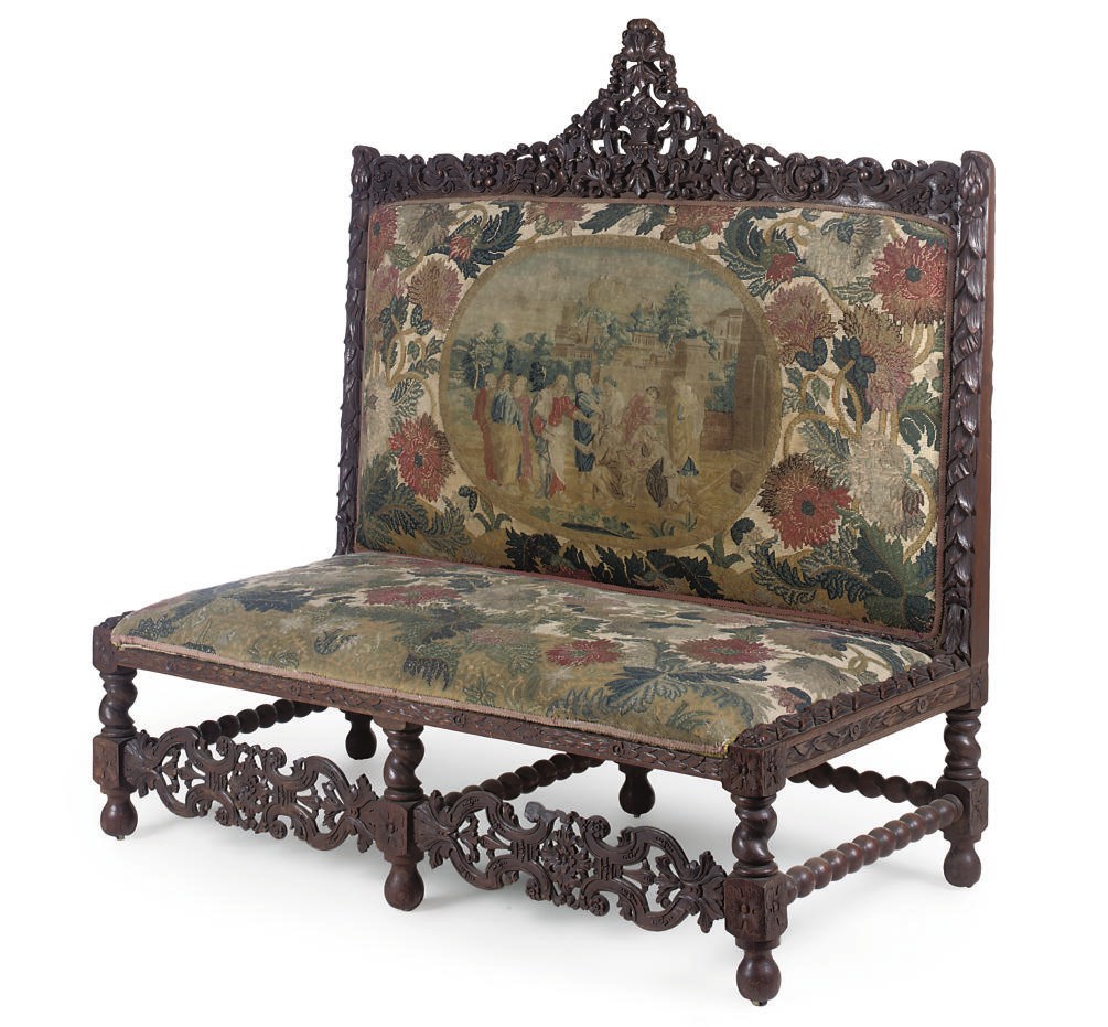 AN OAK AND TAPESTRY UPHOLSTERED SOFA