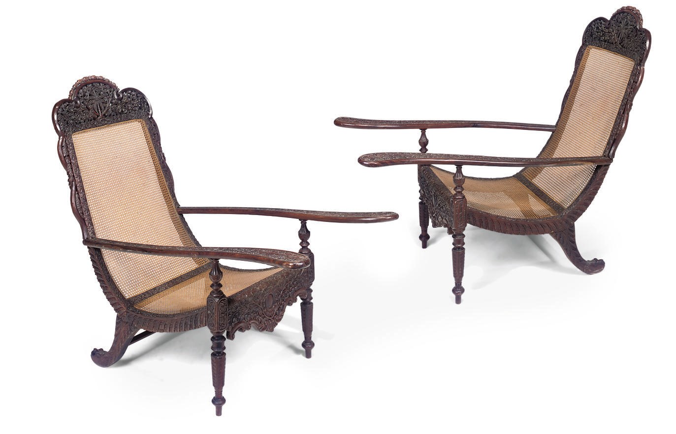 A PAIR OF INDIAN RELIEF-CARVED ROSEWOOD AND CANED PLANTER'S CHAIRS
