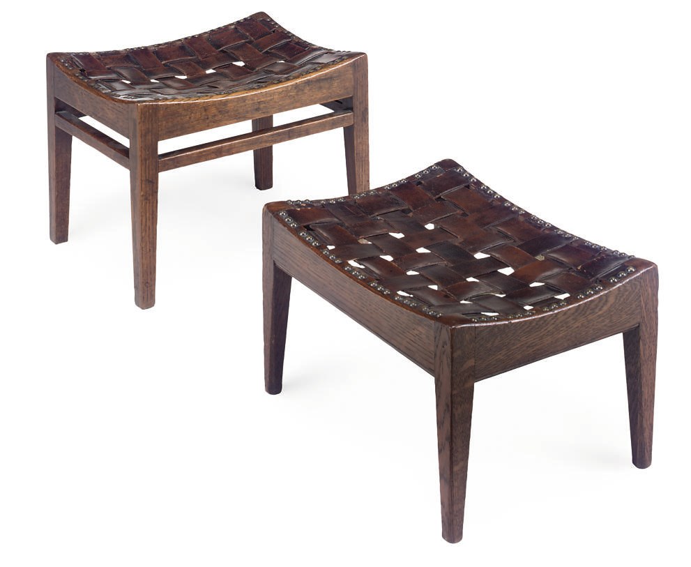 A PAIR OF ARTS AND CRAFTS OAK AND LEATHER STOOLS